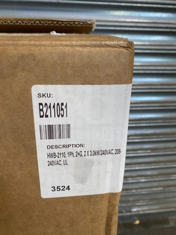 Brand New Fetco HWB-2110 10-Gallon Hot Water Dispenser in box. Label reads SKU: B211051, 1Ph, 24G, 208-240VAC, UL.
