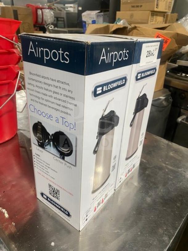 Bloomfield 7760ALM Coffee/Hot Beverage Air Pot in original box, new condition, stainless steel, features push-button top.