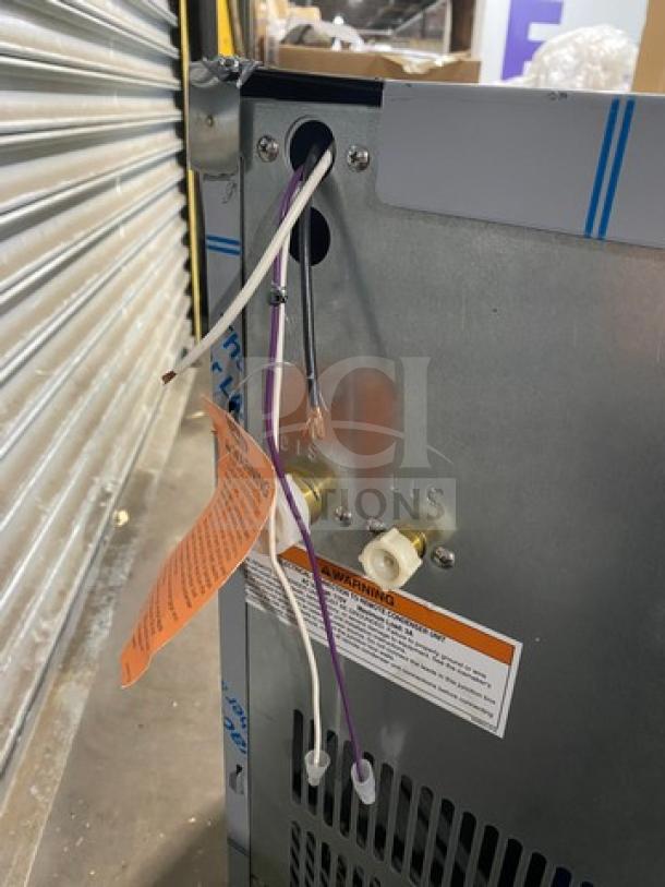 Hoshizaki ice maker KM520MRJ, new condition, visible wiring and warning tags, 115V, 1 Phase. Serial L00706D.