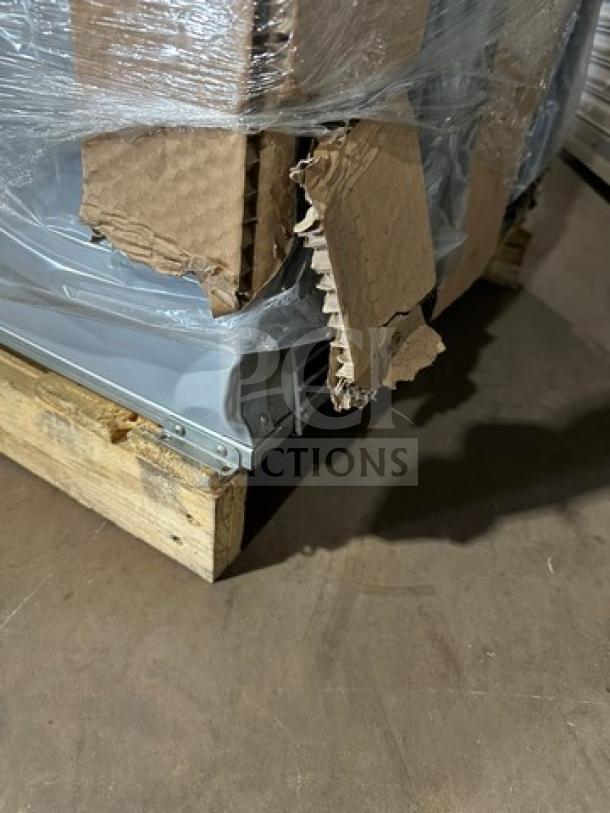 Hoshizaki EF1A reach-in freezer in packaging, scratch-and-dent condition, visible cardboard damage, on wooden pallet.