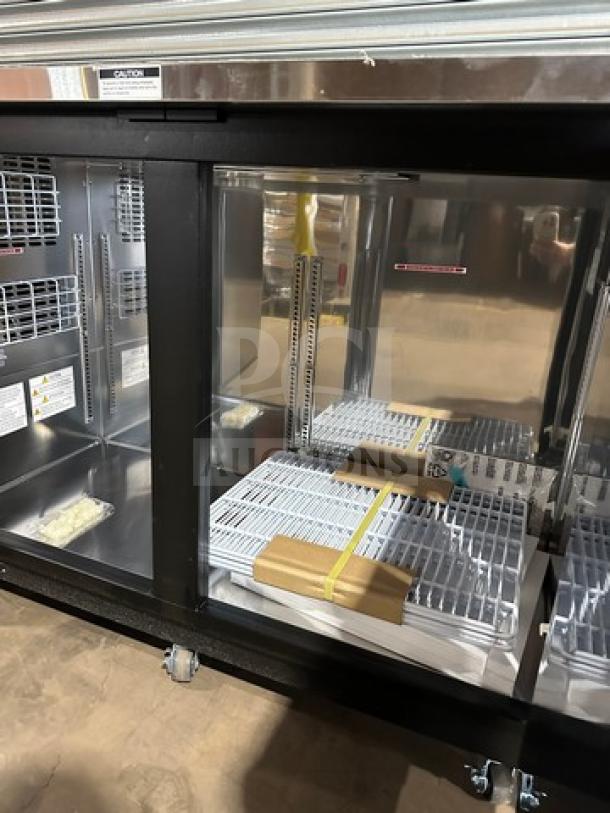 Turbo Air TBB2460SBD-N6 bar back cooler, new condition, 2 solid doors, 120V 1Phase, on casters, interior shelving included.
