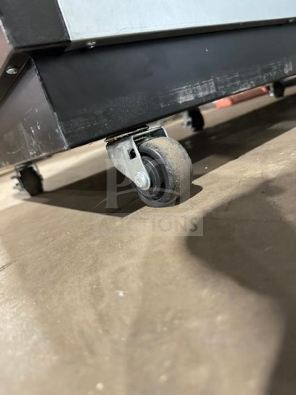 Turbo Air bar back cooler model TBB2460SBDN6 on caster wheels, new condition, solid doors, 120V 1Phase.