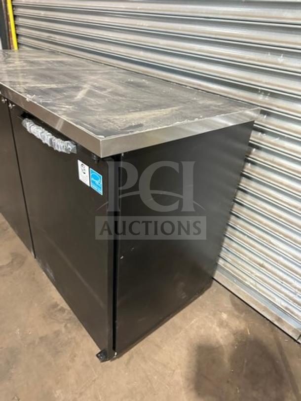 Turbo Air TBB2460SBDN6 bar back cooler, new condition, 2 solid doors, stainless steel top, on casters, 120V 1Phase.