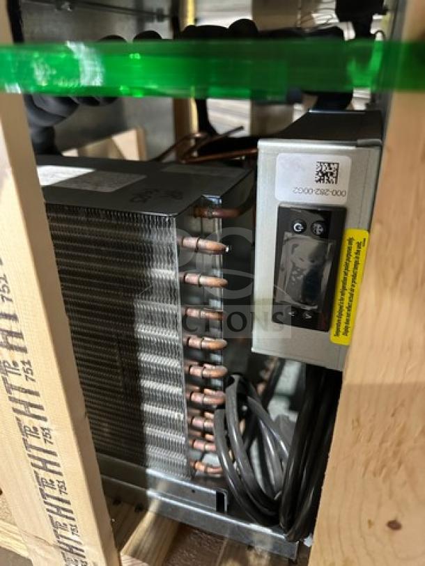 Brand new Delfield 48" refrigerated drop-in cold pan, model 8118, in crate. Features include 115V 1Phase power. Serial: 240282101356.