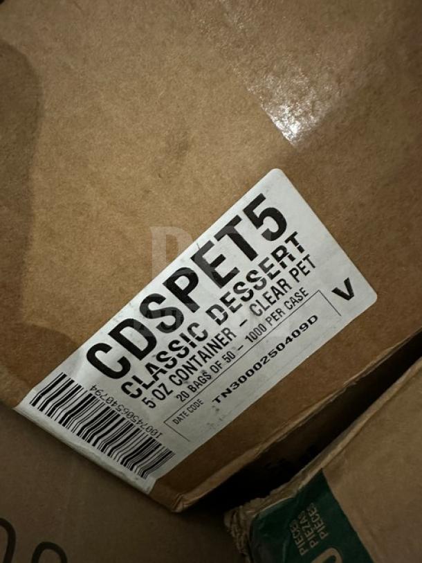 Auction pallet with Sabert FreshPack dome lids, Dart hot beverage lids, and Classic dessert lids. Tagged as CDS PET5.