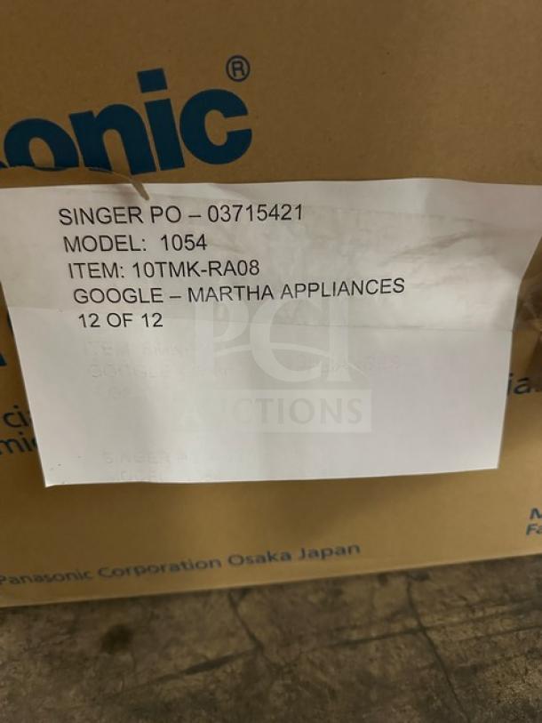Brand new Panasonic NE-1054F commercial microwave in box. Features touch pad, 115V, single phase. Box label with model details visible.