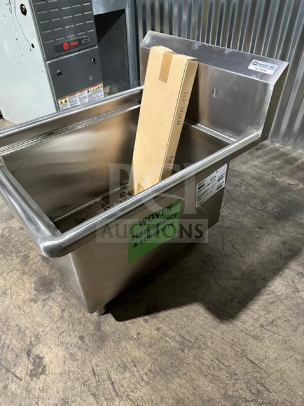 Brand new NBR stainless steel prep sink, model 182414, with legs and strainer. Label reads "Woven Performance & Longevity."