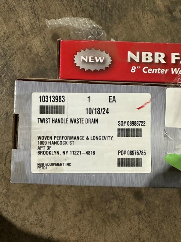 Brand new NBR 8" spread prep sink faucet with twist handle waste drain. Includes product label with shipping info.
