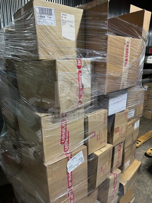 Pallet of assorted high-quality dinnerware and service items, including bowls, trays, tiles, and cutlery, wrapped for auction.