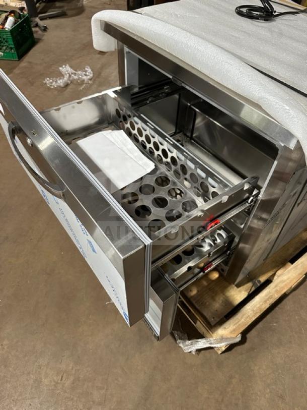 Brand new Continental SW32N 2-drawer refrigerated lowboy/worktop cooler. Includes packaging; model and serial number visible.