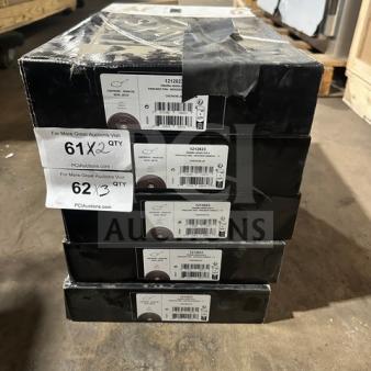 Stack of boxed skillets on pallet; labels show model 12128321, 12-inch size, and black packaging. Each box has auction details, quantities 2 and 3 listed.
