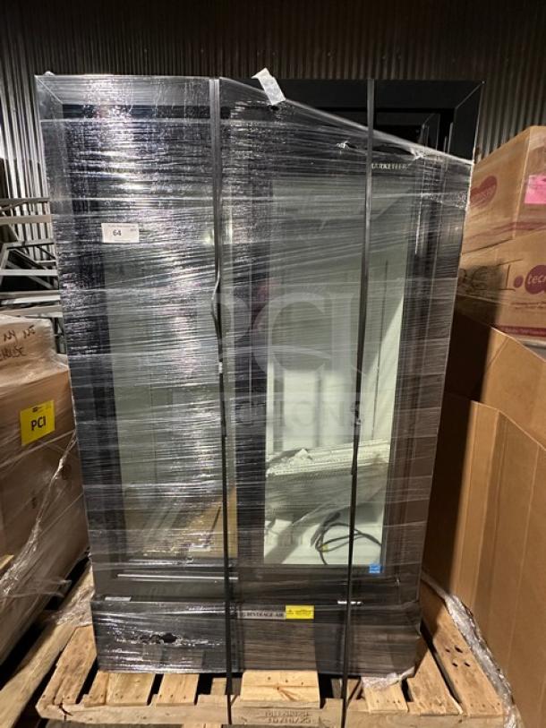 Beverage Air commercial display cooler, wrapped in protective plastic, black frame, glass door, good condition, on pallet.