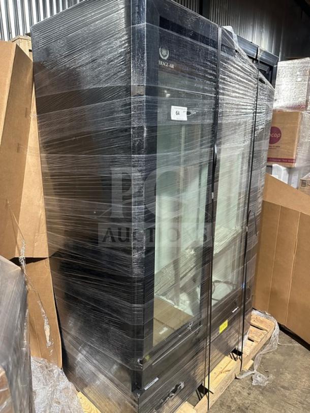 Beverage Air commercial refrigerator, glass door, wrapped for protection, model info obscured, appears in good condition.