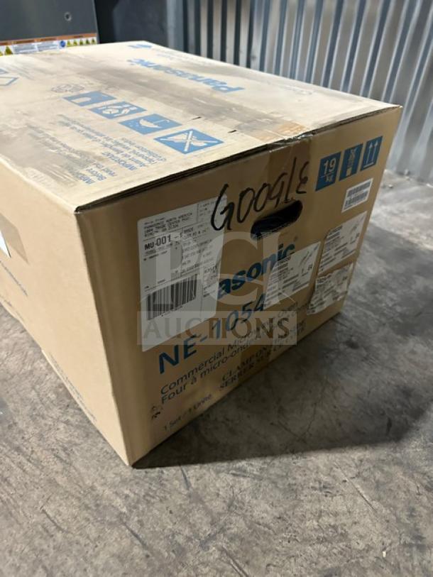 New Panasonic Pro Microwave model NE1054 in box, featuring a digital touch pad, 115V 1 phase, with labeling and markings.