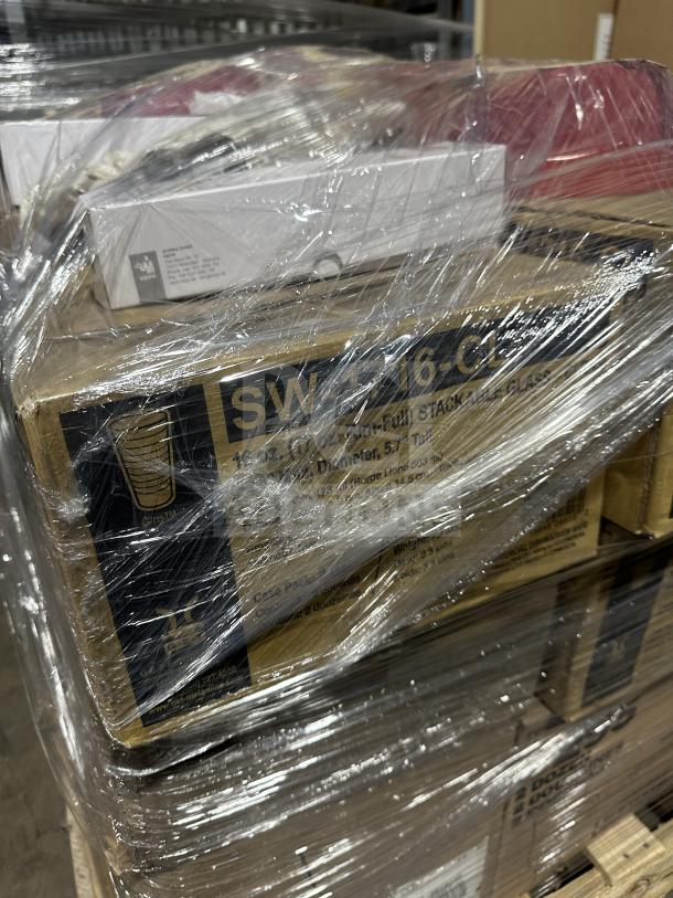 Mixed pallet of brand new items, including Mikasa china, Rish mugs, Vertex plates, and stainless cutlery, wrapped in plastic.