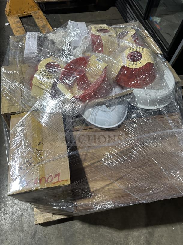 Mixed pallet with boxes and items wrapped in plastic, including Mikasa china, Vertex plates, knives, and silicone cake pans.
