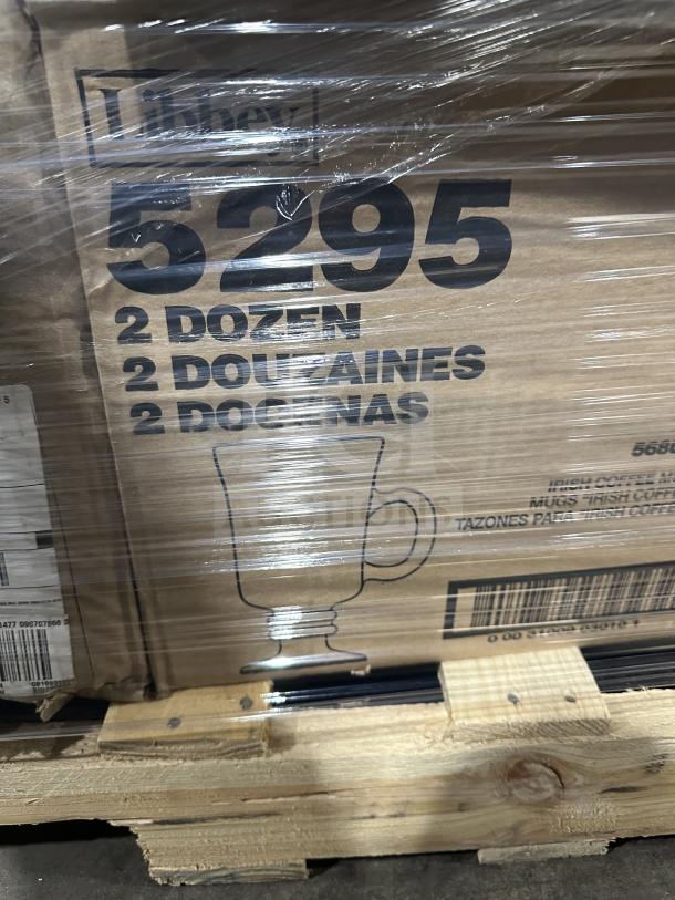 Mixed pallet with boxes labeled "5295" containing 2 dozen pieces, visible branding reads "Libbey," wrapped in plastic on a wooden pallet.
