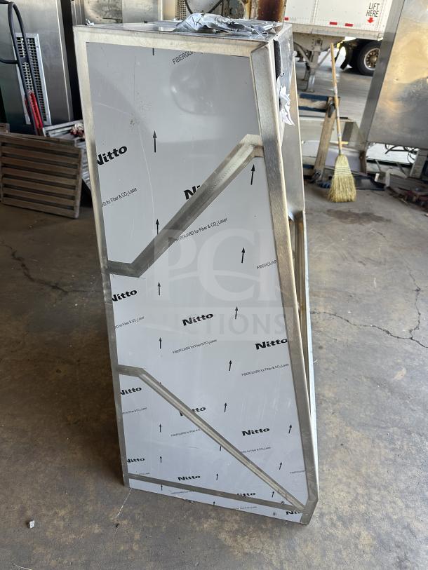 NEW Captive Air 72" stainless steel exhaust hood in protective wrapping, labeled "Nitto," pristine condition.
