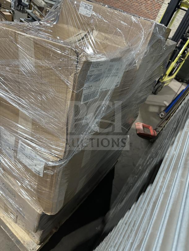 Wrapped pallet with various boxed items including creamers, whisky tumblers, dinner knives, platters, and toasters.