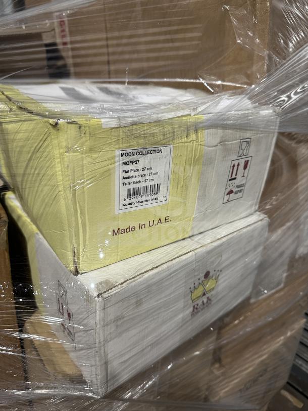 Mixed pallet auction item. Includes boxes of creamer, whisky tumblers, platters, dinner knives, Prepline toasters. Boxes labeled "Moon Collection," made in UAE.
