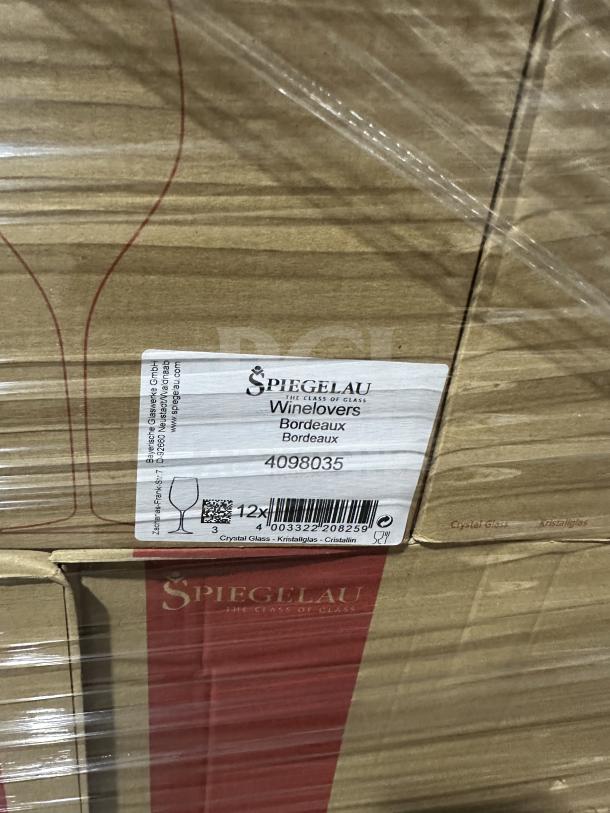 Auction pallet with boxes labeled Spiegelau Winelovers Bordeaux glasses, wrapped in plastic. New condition.