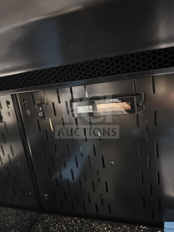 Structural Concepts Oasis 36" black laminate refrigerated undercounter merchandiser, model CO3324R. Serial number: 2697161AA405905.