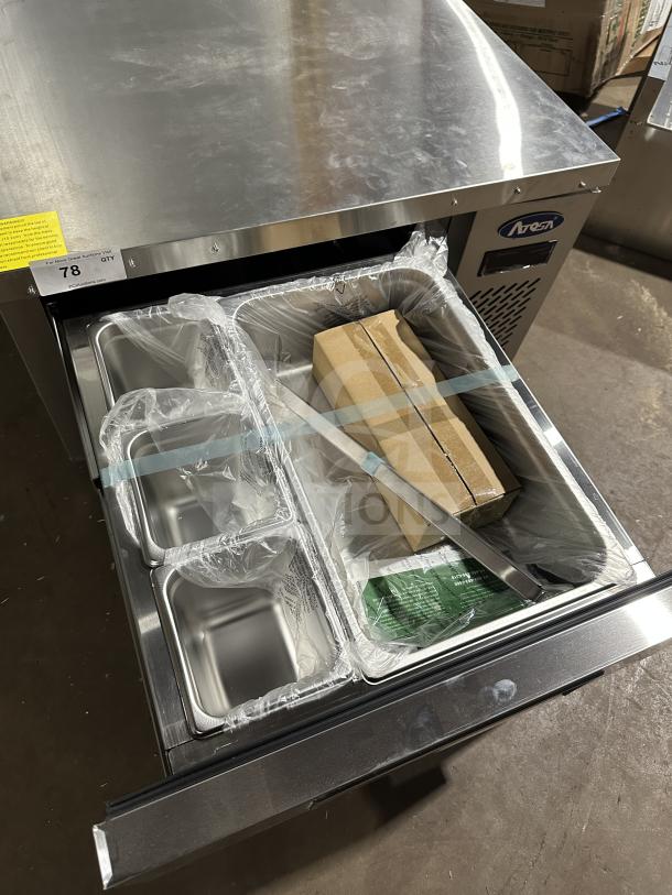 Atosa stainless steel chef base refrigerator, model MGF8448GR, brand new, on casters with electrical specs label visible.