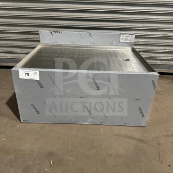 Brand new Krowne KR24-GS30 stainless steel work table with perforated drain board. Model and serial number tags visible.
