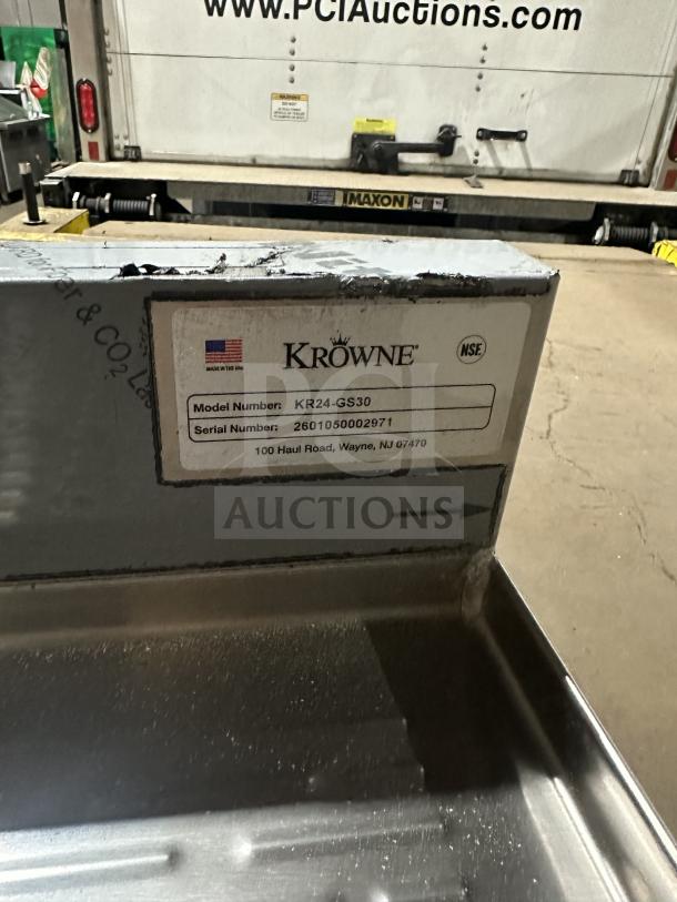 Brand new Krowne KR24-GS30 stainless steel work table with built-in perforated drain board, model shown, SN: 2601050002971.