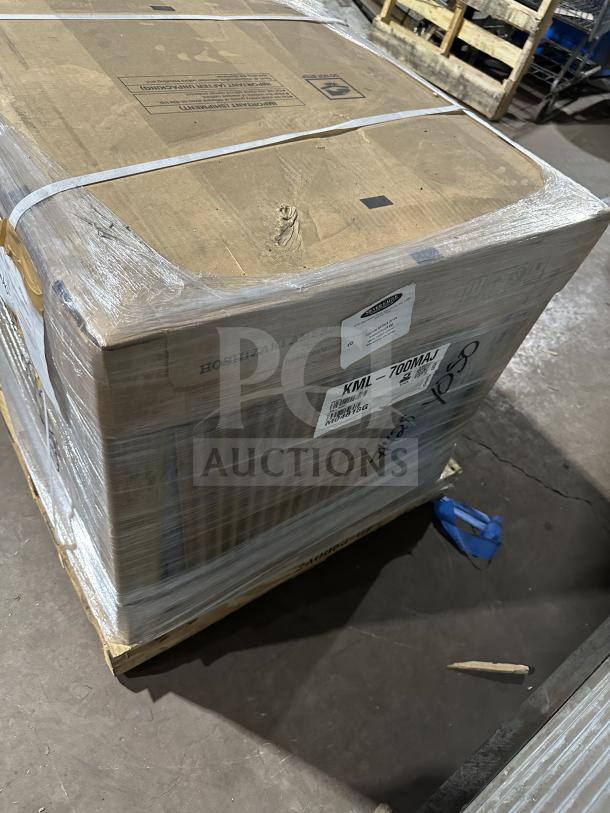 Brand new Hoshizaki stainless steel air-cooled ice maker, model KLM-700MAJ, packaged on a pallet.