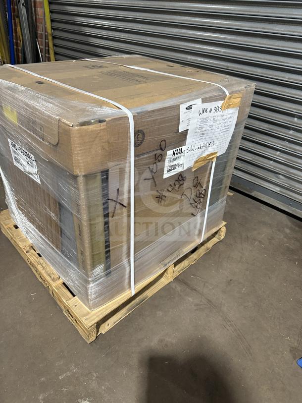 Brand new Hoshizaki KLM-700MAJ commercial ice maker in sealed packaging. Model and serial numbers visible on label.
