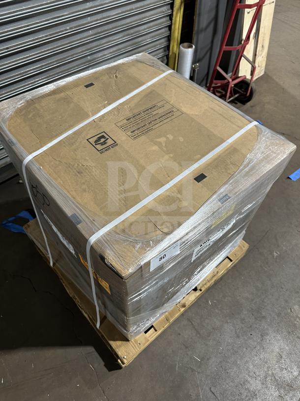Brand new Hoshizaki KLM700MAJ ice maker, sealed in box on pallet, featuring crescent cubes, Energy Star rated.
