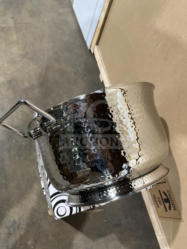 Brand new commercial stainless steel ice bucket/beverage tub with hammered finish; features sturdy handles and cylindrical shape.