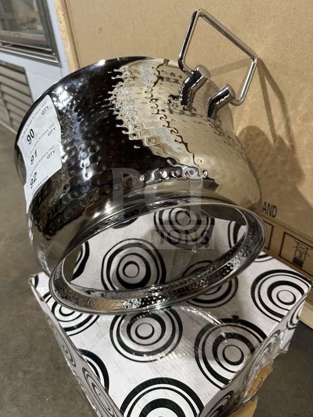 Brand new commercial stainless steel ice bucket with textured finish, sturdy handles, and original packaging visible.