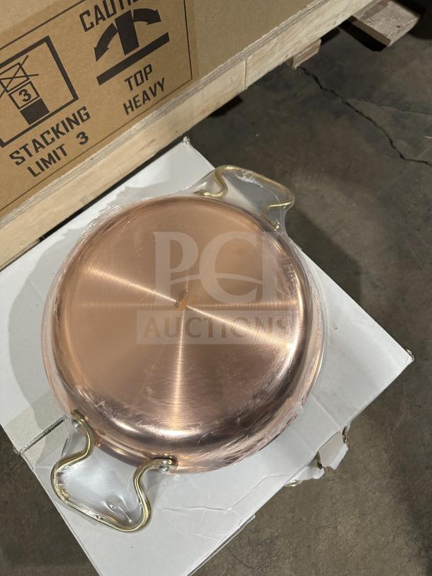 Paderno Copper Series round gratin pan, model A1551524. Brand new stainless steel with protective wrap and brass handles.