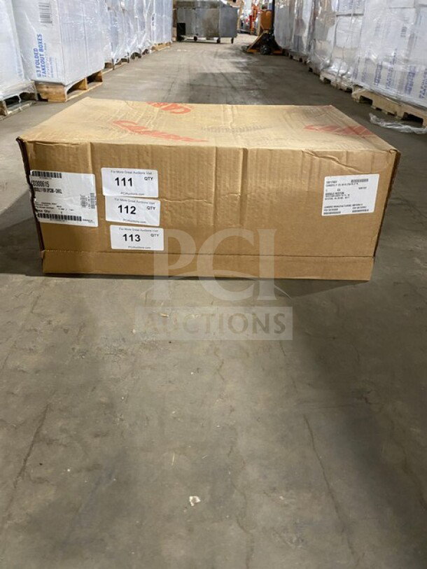 Brand new Cambro Cam Dolly Model CD300615 in box, charcoal gray. Box shows shipping labels and appears in excellent condition.