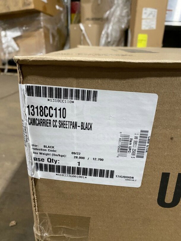Brand new Cambro Ultra Cam Sheet Pan Carrier model 1318CC110 in black, shown in original packaging.