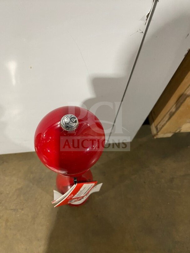 Brand new Peugeot Paris MP40 black pepper crusher, high-quality, with visible top adjustment knob and attached tags.