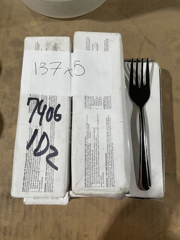 Brand new commercial stainless steel salad forks, 2 dozen per box. Includes five boxes. Labels show "137 x 5" and "7406 1DZ."