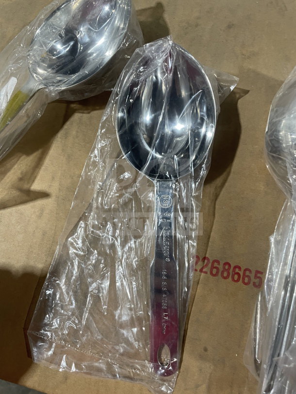 Brand new Vollrath 47058 stainless steel 1/2 cup serving spoon in packaging. Marked NSF, durable design.