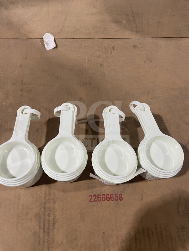 Brand new Winco Commercial White Measuring Cup Set, Model L38315A0WHT, in pristine condition.