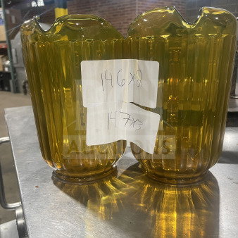 Brand new Rubbermaid gold beverage pitchers, model FG333800GOLD, with ribbed design. Auction labels attached.