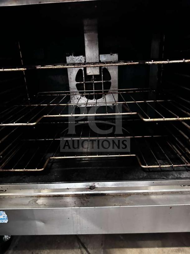 Exceptional Vulcan VC55GD double stack natural gas convection oven, heavy-duty, with casters. Fully tested, operational.