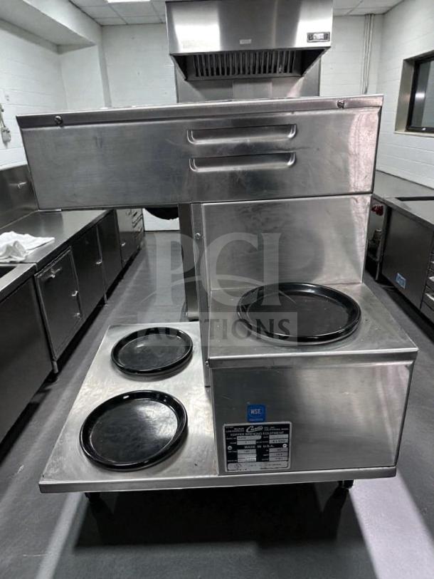 Wilbur Curtis Alpha 3 automatic coffee brewer in like-new condition with three warming plates, labeled as UL and NSF listed.