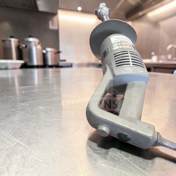 Robot Coupe MP450VV commercial immersion blender, 18" shaft, variable speed, heavy-duty, elite condition, on a metal countertop.