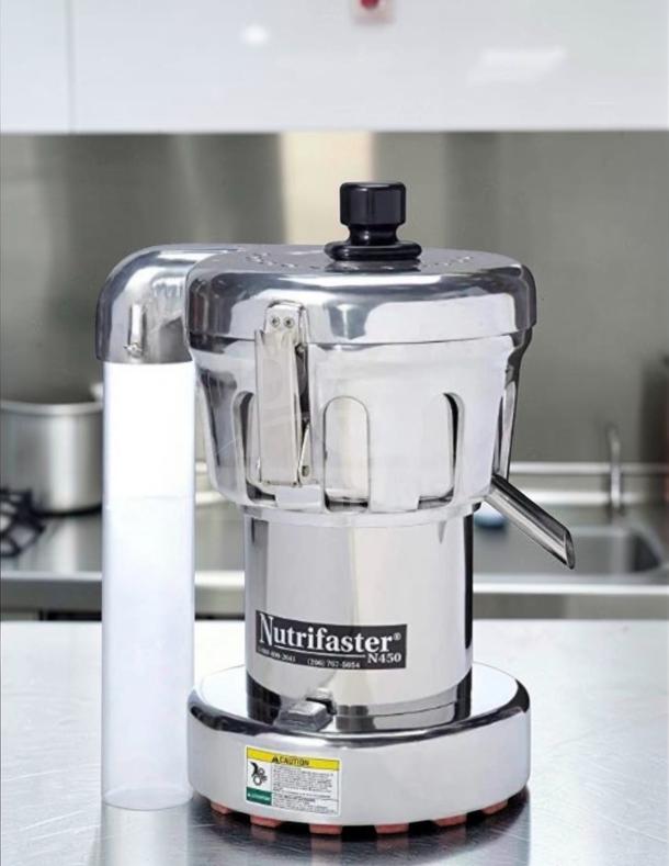 Nutrifaster N450 commercial juicer in elite condition, heavy-duty stainless steel, high-performance, fully tested, model label visible.