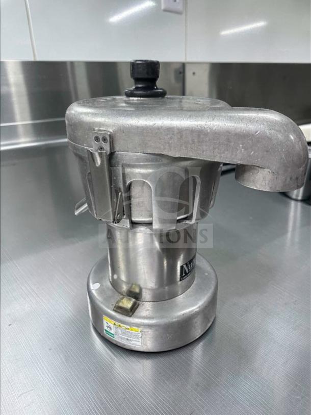 Nutrifaster N450 commercial juicer, stainless steel, high-performance, fully tested. Elite condition, includes visible labels.