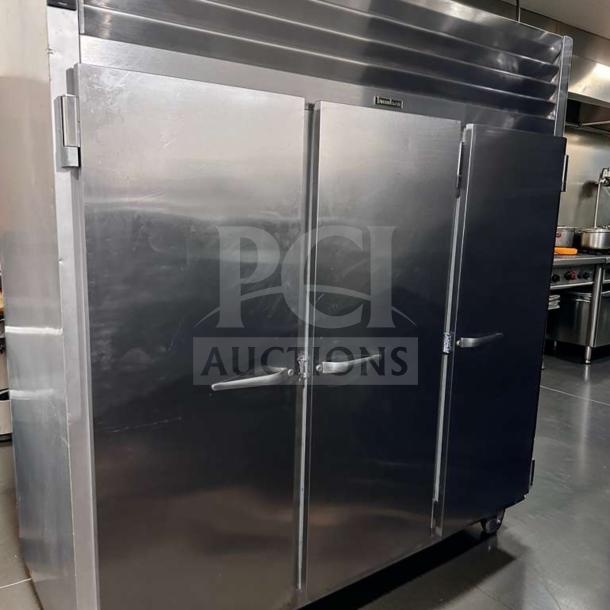 Traulsen G31310 reach-in freezer, 77" three-section solid door, commercial stainless steel, 208/115V, elite condition.