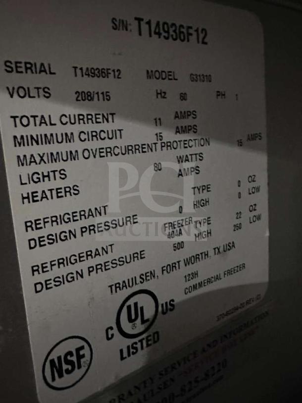 Traulsen G31310 reach-in freezer label showing serial T14936F12, 208/115V. Features UL, NSF marks, fully tested.