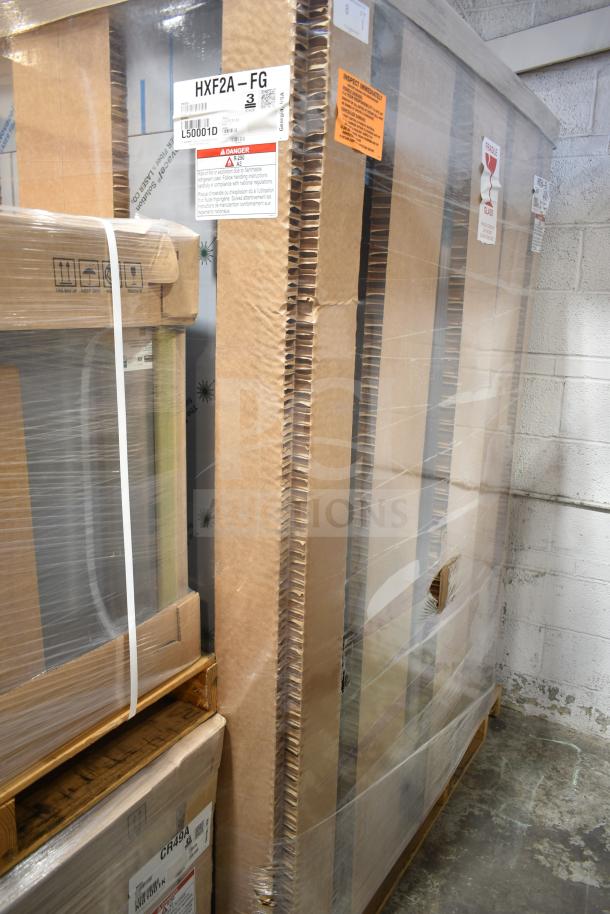 Brand new 2021 Hoshizaki HXF2A-FG freezer, two-section upright, full glass doors, 115V, in packaging with labels visible.
